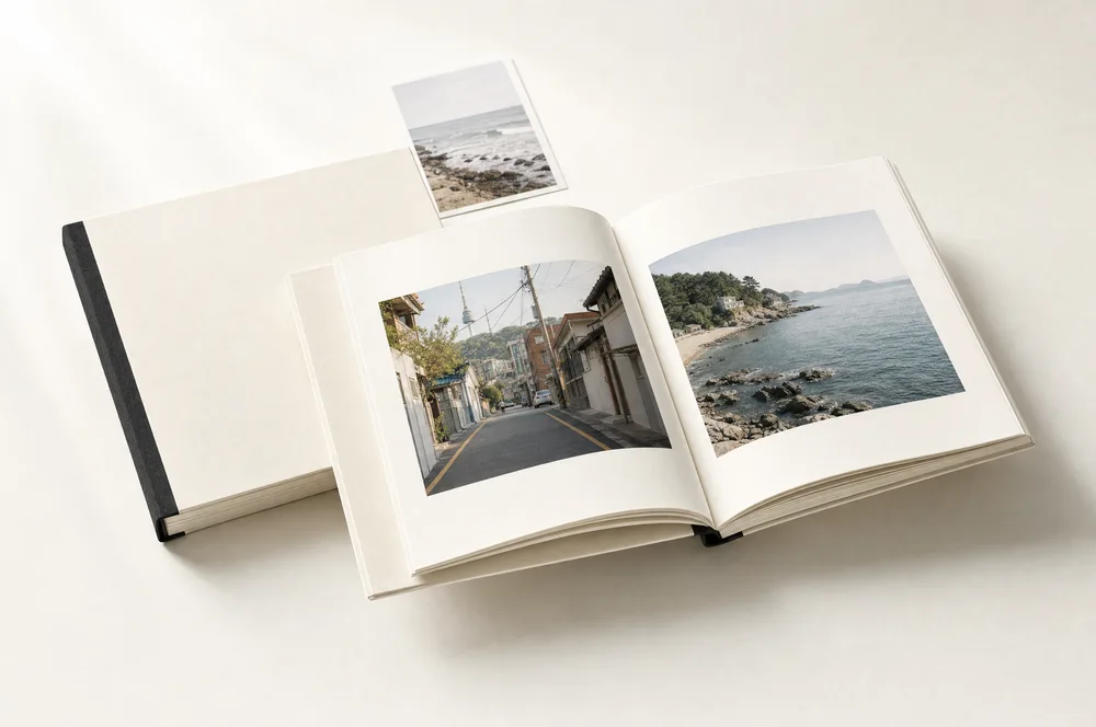 DAMDA album concept showing the cream cover and printed inside pages